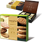 three boxes of assorted cookies and pastries on display in front of each other