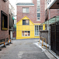 Kafé Nordic咖啡厅 Yellow house-shaped facade fronts cafe by Nordic Bros. Design Community | 灵感日报