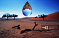 Large drop of water above desert (digital composite)_创意图片