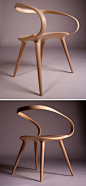 This flowing, curved wooden armchair was designed by Jan Waterston, after he was inspired by cycling.: