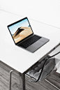 MacBook Pro on White Table at Home Free Stock Photo