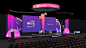 This may contain: the stage is set up for an event with people sitting on it and one person standing in front