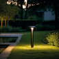 ilaishit_A_lawn_lamp_stands_tall_on_the_lawn_emitting_a_clear_l_af68e001-b6a7-4a3e-b9ea-c8eb4e6cfdd1