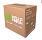 a cardboard box with hello fresh written on the front and side, sitting in front of a white background