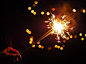 Person Holding Lighted Firecracker