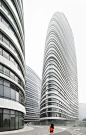 These new images by German photographer Robert Herrmann show the near-complete external structures of Zaha Hadid's Wangjing Soho complex, which is scheduled to open later this year in Beijing.