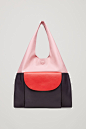 Colour-block leather tote bag - Pink  - Bags & Purses - COS US : Designed with bold colour-block detailing, this bag is made from smooth leather with a cotton-twill lining at the base. A slouchy style, it has a large front pocket with a hidden zip and