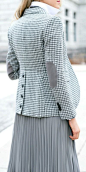grey houndstooth blazer with elbow patches and leather buttons down back, shawl collar sweater, popped collar button down + pleated midi skirt