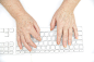 Hands of an old female typing on the keyboard, isolated on white, close-up. by Danil Roudenko