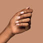 KISS Bare But-Better Nails - Short TruNude nail shades while model is wearing them