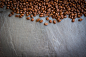 Coffee beans on black stone background