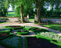 Design ideas for a traditional formal garden in London with gravel.