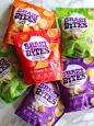 four bags of baked bites chips on a marble counter