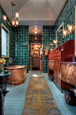 the floor, teal wall tile + copper accents.