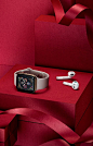 This may contain: an apple watch sitting on top of a red box next to a pair of ear buds