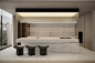 This may contain: a modern kitchen with two stools in front of the counter