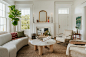 A living room filled with furniture and a fire place