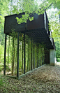 Modern tree house holiday rental - Bamboo shoots upward through steel grates to your private slate and steel catwalk and terrace - Scogin & Elam design