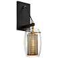 The Savoy House Dunbar Wall Sconce features an industrial-chic style with its oval of clear glass encompassing a mesh inner shade. Its 2-tone Warm Brass finish with bronze accents creates a fashion-forward look while staying modern. Place Dunbar in your h