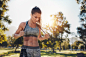 Fit young woman with a skipping rope at the park