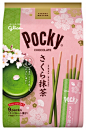 a package of green tea sticks with flowers on it and the packaging is pink in color