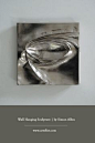 Discover this silver wall hanging sculpture by contemporary artist Simon Allen. Hand carved in wood and then painted silver this makes for a stunning living room decor. Find his full collection of work on our dedicated artist page. #hangingsculpture #wall