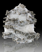 mineralists:

Shiny silver Dyscrasite crystals with Allergentum in Calcite from Morocco