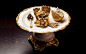 迪拜购物中心布鲁姆斯伯里咖啡馆的金凤凰蛋糕是世界上最贵的杯装蛋糕。采用了23克拉的可食用金箔纸，售价高达648英镑(6480人民币)。