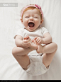 Laughing Caucasian baby girl - stock photo