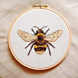 An embroidered honeybee. very realistic yet beautiful and highly effective