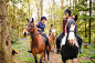 Horseback riders talking in forest by Gable Denims on 500px