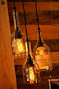 Fun lighting with old liquor bottles.... cool idea for our back porch bar area we are gonna set up