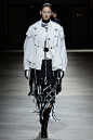 Image may contain Clothing Coat Apparel Runway Human Person and Fashio