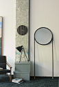Mirrors Collection : Circular Mirror.The series of Mirrors are designed to leanagainst a wall, supported on long steel tubularlegs with cork feet. They are available in black,and two different shapes. At the rear there is a hole for hanging wall.Handmade 