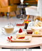 Relaxing and leisure with strawberry cake in the hotel interior  - stock photo