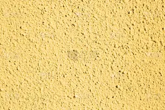 用中性黄色绘制的有很多纹理的墙作为背景