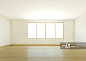 An empty white room with wooden flooring_创意图片