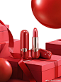 This may contain: a red box with two lipsticks on it and a balloon in the sky above