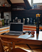 macbook pro on brown wooden table