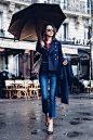 This cropped military jacket adds a feminine silhouette to this outfit. Annabelle Fleur coordinates a red shirt with the braiding on the jacket sleeve and detail in the bag. Paired with a slim legged jean and a navy long trench this look is...