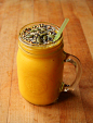 Mango Orange Banana Smoothie (approx. 1 cup orange juice, 1/2 cup frozen mango, and 1 banana) topped with buckwheat, chia seeds, hemp hearts, and pumpkin seeds.