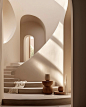 其中可能包括：the interior of a modern house with white walls and stairs leading up to an arched doorway