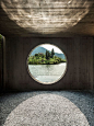 a series of concrete forms overlooking the waterfront contain tea houses of varying sizes offering a range of privacy and access to several courtyards.: 