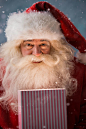 Portrait of happy Santa Claus opening gift box by Kirill Kedrinski on 500px