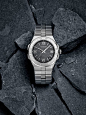 Chopard Alpine Eagle on grey stones in front view