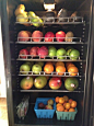 Wine fridge repurposed as a fruit chiller. Keeps fruit fresh and front and center for the kids to snack on.