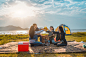 Diversity women party clink bottles enjoy camping,trekking,travel in vacation time relax.