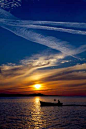 #Mykonos is known for its spectacular sunsets and this was no different. The little fishing boat that just sailed into the scene was pure luck and completed the image. #Greece #Mediterranean (Photo by: Marco van Belleghem)