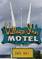 Village Inn Motel Vintage neon sign.