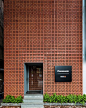 in the city of hanoi, vietnam, the vertical building is made up of perforated terracotta blocks regulating airflow, while serving as a 'lantern' at night.: 